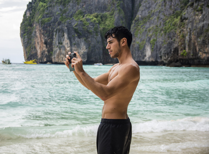 Man Taking A Photo On A Beach