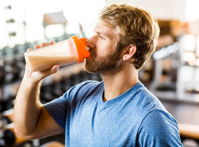 man drinking whey protein