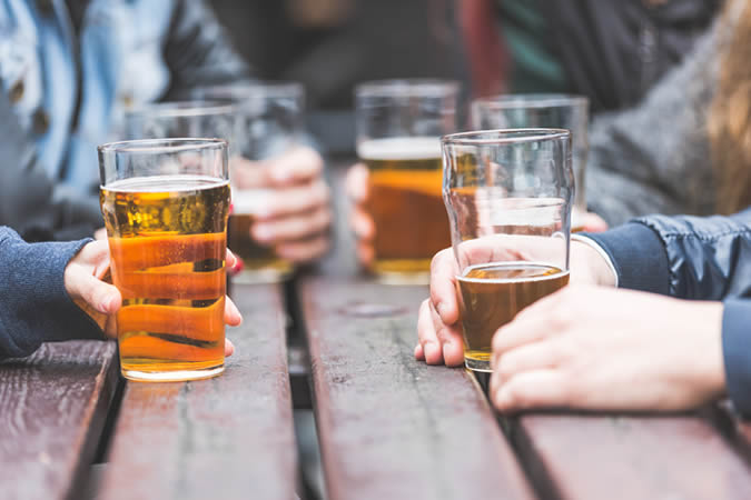 Pints of beer at a table
