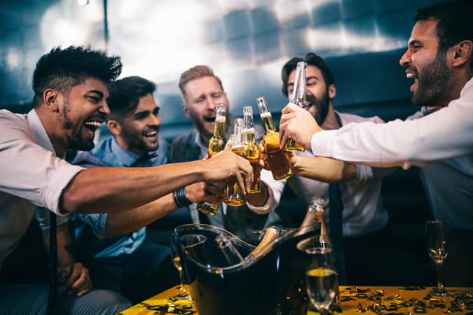 Group of men raising a toast