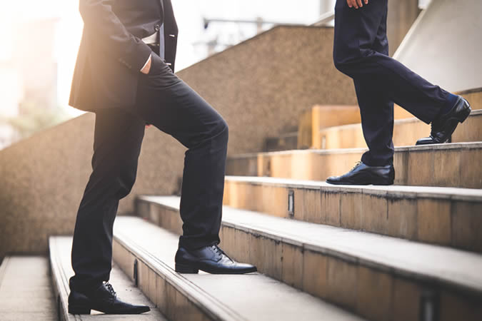 Men walking up and down steps
